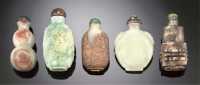 Master of the Rocks School 1740-1840 A carved pale celadon and russet jade snuff bottle